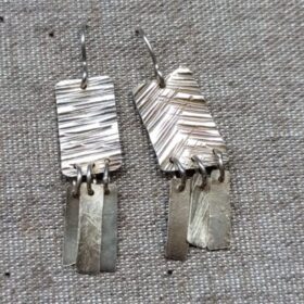 plata quadrats rectangles textura arracades ganxo